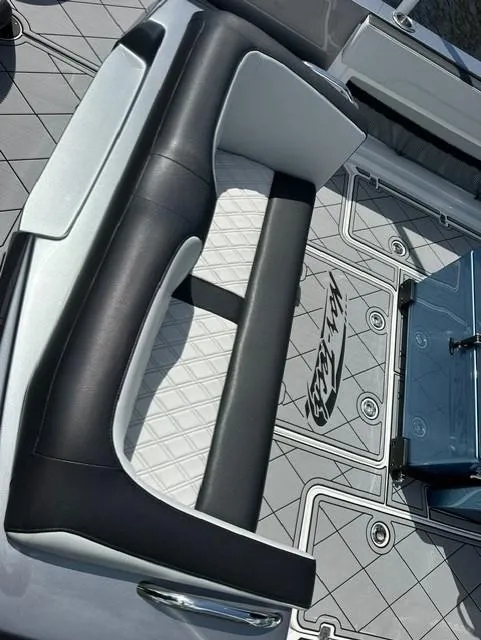 Slide: The Image of 2024 Nor-Tech 390 Sport boat interior with stylish seating and custom flooring. - 19
