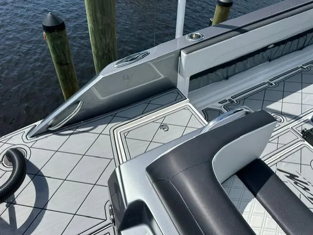 Slide: The Image of 2024 Nor-Tech 390 Sport boat deck with sleek design and modern seating. - 20