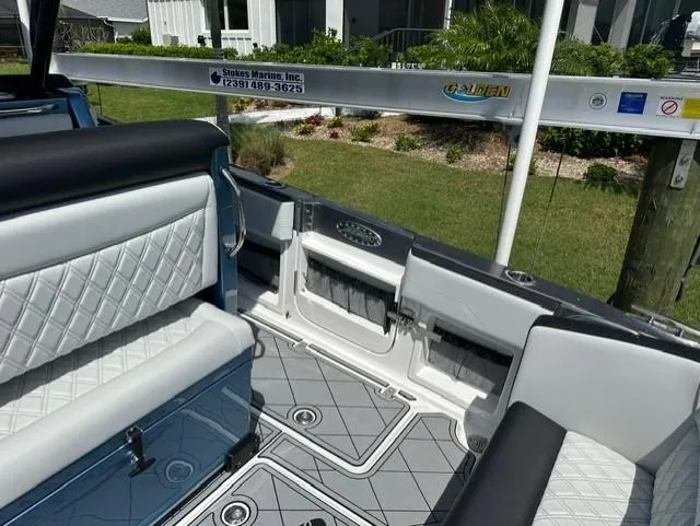 Slide: The Image of 2024 Nor-Tech 390 Sport boat interior with diamond-stitched seating and modern design elements. - 22