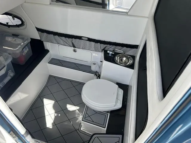 Slide: The Image of 2024 Nor-Tech 390 Sport boat interior with modern bathroom amenities. - 26
