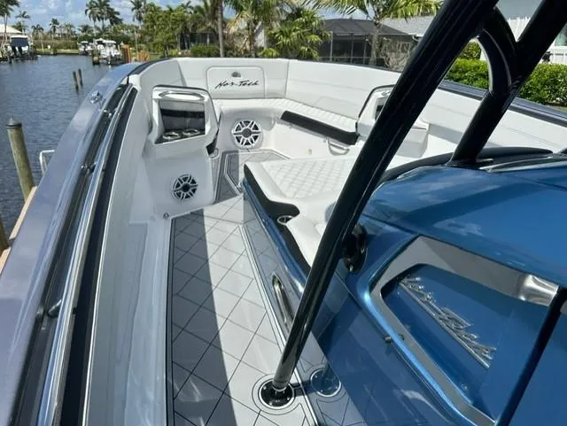 Slide: The Image of 2024 Nor-Tech 390 Sport boat interior with sleek seating and modern design. - 28