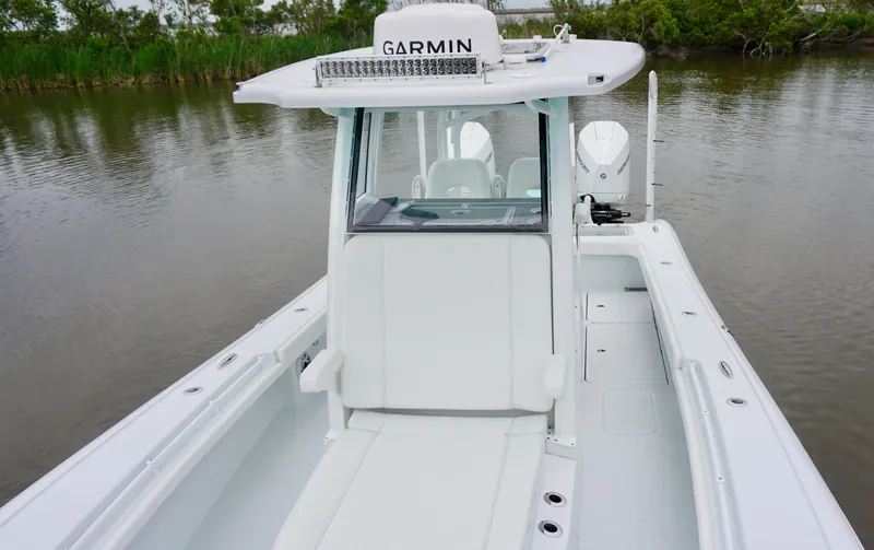 Slide: The Image of 2022 Costa Custom Boats 264 HC on calm water, featuring Garmin equipment. - 10