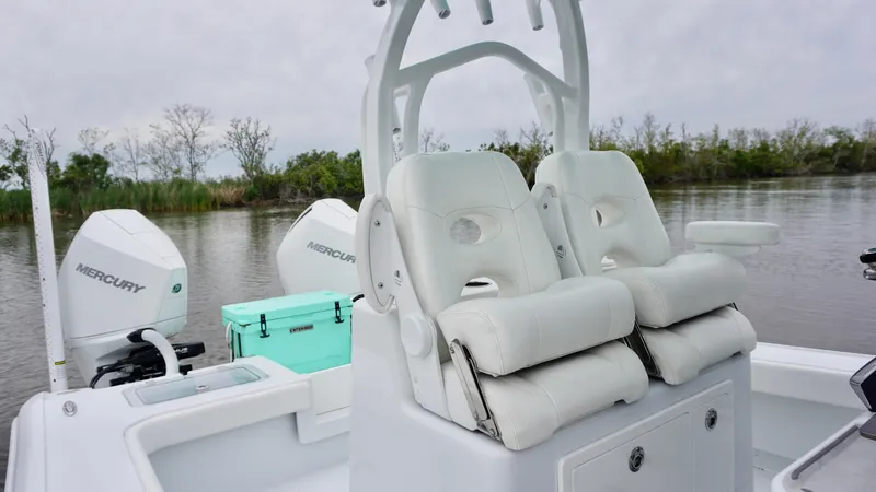 Slide: The Image of 2022 Costa Custom Boats 264 HC with dual Mercury engines, white seating, and a turquoise cooler. - 15