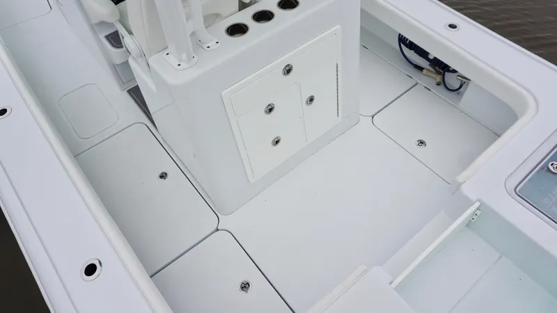 Slide: The Image of 2022 Costa Custom Boats 264 HC deck with storage compartments and rod holders. - 19