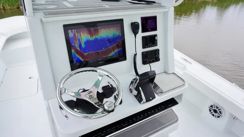 Slide: The Image of 2022 Costa Custom Boats 264 HC helm with advanced navigation and control systems. - 24