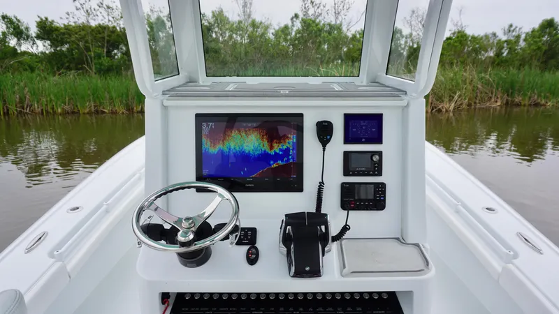 Slide: The Image of 2022 Costa Custom Boats 264 HC helm with advanced navigation and control systems. - 25