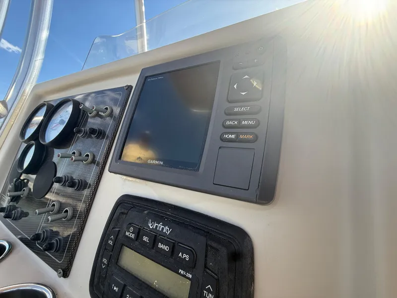 Slide: The Image of Control panel of 2015 Pioneer 180 Islander boat with Garmin display and gauges. - 13