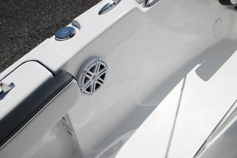 Slide: The Image of 2025 Tidewater 198 CC Adventure boat interior with speaker and seating detail. - 15