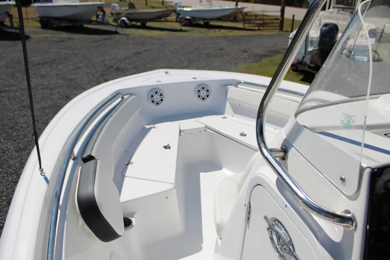 Slide: The Image of 2025 Tidewater 198 CC Adventure boat interior with seating and console. - 16