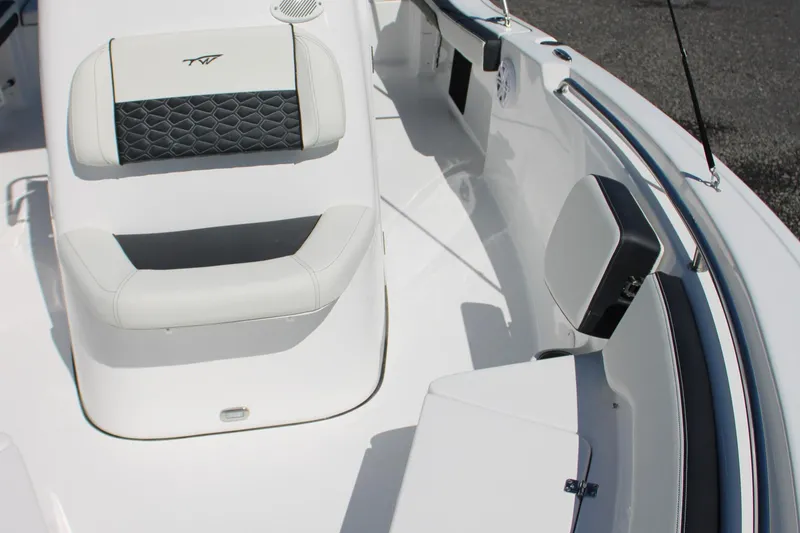 Slide: The Image of 2025 Tidewater 198 CC Adventure boat interior with cushioned seating and sleek design. - 22