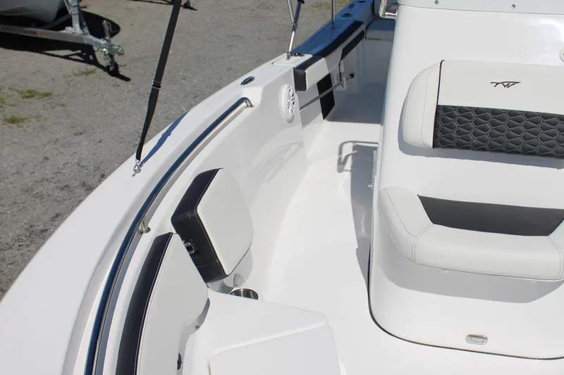 Slide: The Image of 2025 Tidewater 198 CC Adventure boat interior with cushioned seating and sleek design. - 23