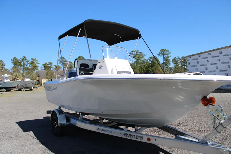 Slide: The Image of 2025 Tidewater 198 CC Adventure boat on trailer, featuring a sleek design and canopy. - 5