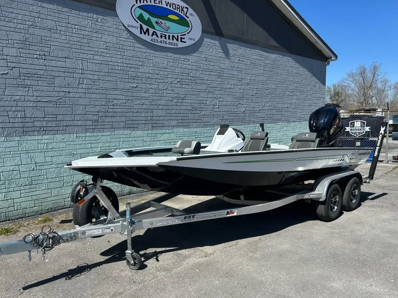 Slide: The Image of 2025 Xpress X19 Pro boat on trailer outside Water Workz Marine. - 2