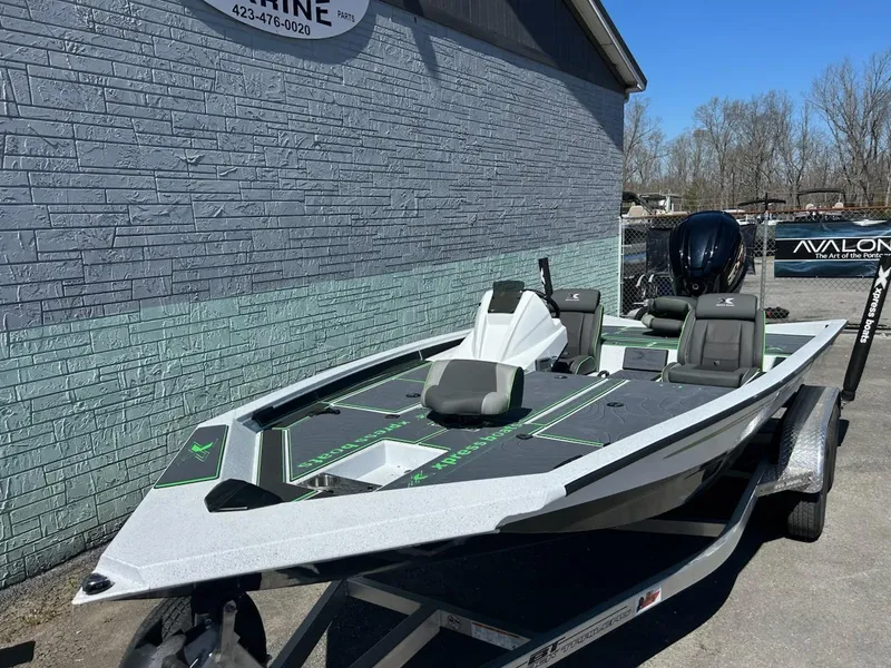 Slide: The Image of 2025 Xpress X19 Pro boat on trailer, parked outdoors. - 3