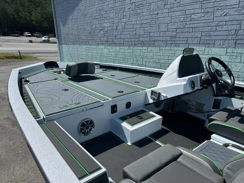 Slide: The Image of 2025 Xpress X19 Pro boat interior with modern seating and steering console. - 4