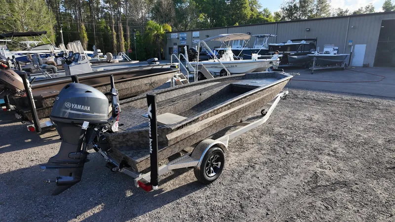 Slide: The Image of 2025 Xpress H18DB boat with Yamaha motor in outdoor showroom. - 17