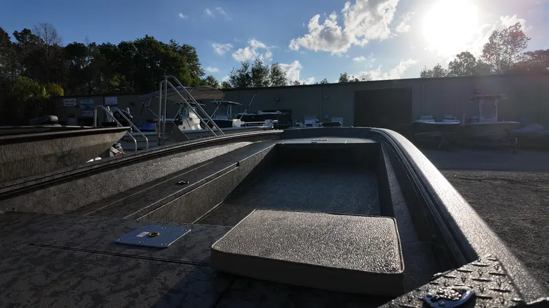 Slide: The Image of 2025 Xpress H18DB boat in a sunny outdoor setting, showcasing its sleek design. - 21