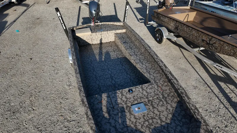 Slide: The Image of 2025 Xpress H18DB boat with camouflage pattern on a gravel surface. - 25