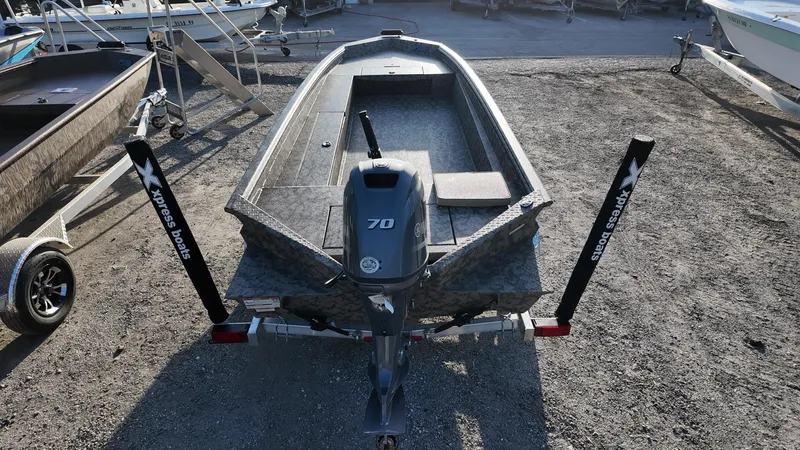Slide: The Image of 2025 Xpress H18DB boat on trailer, rear view, outdoors. - 30