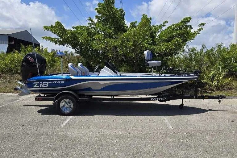 Slide: The Image of 2025 Nitro Z18 boat in a parking lot, featuring sleek design and modern features. - 1