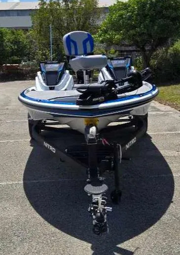 Slide: The Image of 2025 Nitro Z18 boat parked outdoors, featuring a sleek design and modern equipment. - 5