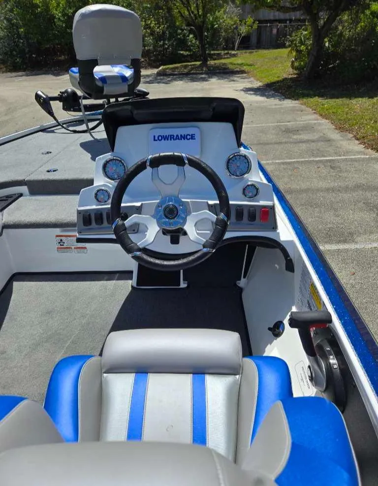 Slide: The Image of 2025 Nitro Z18 boat dashboard with steering wheel and Lowrance electronics. - 6
