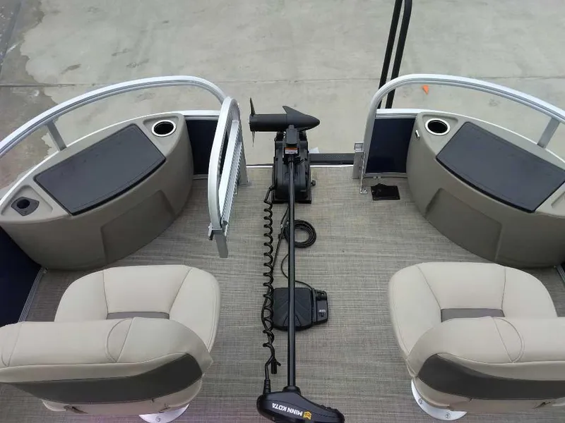 Slide: The Image of 2025 Sun Tracker Bass Buggy 18 DLX interior with seating and control panel. - 5