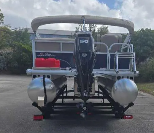 Slide: The Image of 2025 Sun Tracker Bass Buggy 16 XL Select pontoon boat with 50 HP outboard motor. - 11