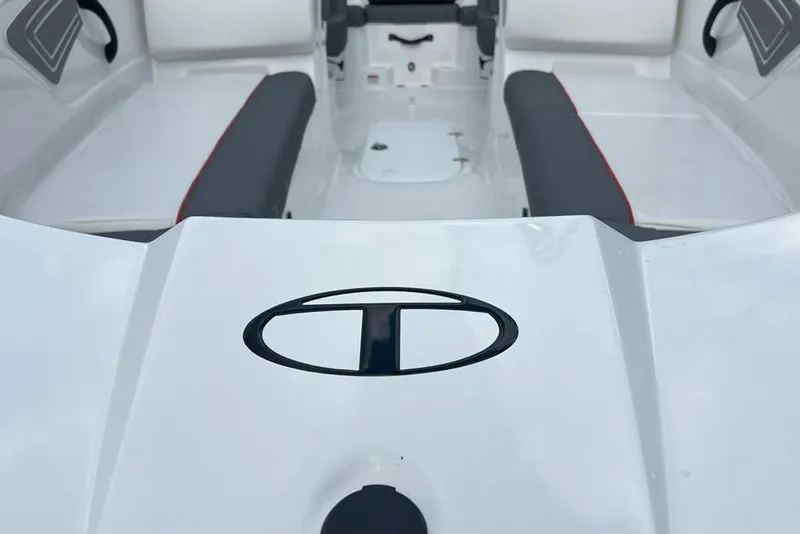 Slide: The Image of 2025 Tahoe T21 boat interior with logo, featuring sleek seating and modern design. - 2