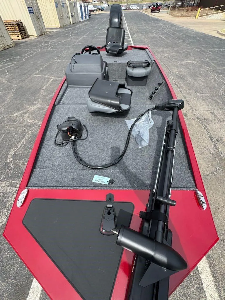 Slide: The Image of 2025 Tracker Bass Tracker Classic XL boat with red exterior and fishing seats. - 4