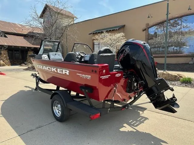 Slide: The Image of 2025 Tracker Pro Guide V-175 Combo boat with outboard motor on a trailer. - 2