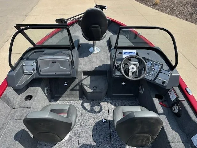 Slide: The Image of 2025 Tracker Pro Guide V-175 Combo boat interior with steering console and seating. - 6