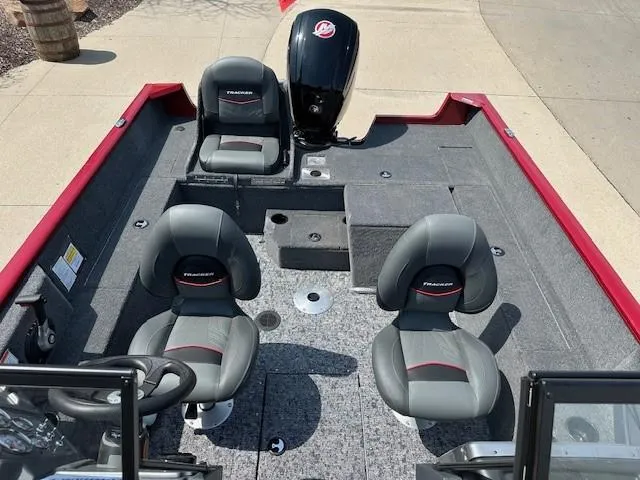 Slide: The Image of 2025 Tracker Pro Guide V-175 Combo boat interior with seating and motor. - 8