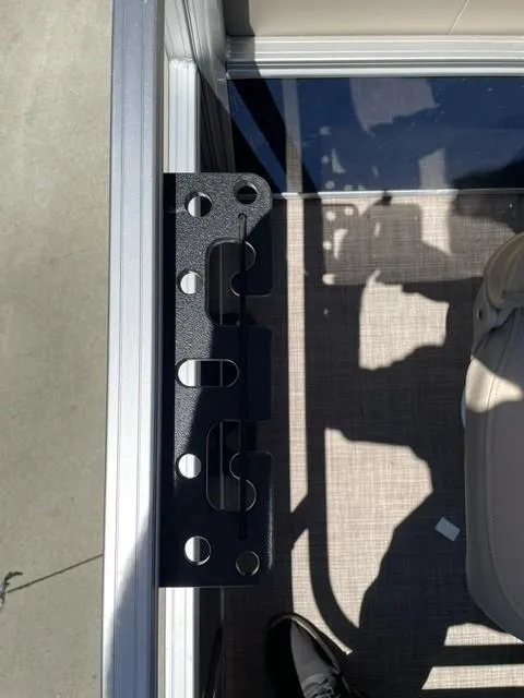 Slide: The Image of 2025 Sun Tracker Bass Buggy 18 DLX boat interior with metal bracket detail. - 6