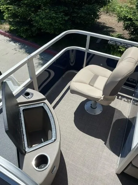 Slide: The Image of 2025 Sun Tracker Bass Buggy 18 DLX boat interior with seating and storage. - 7
