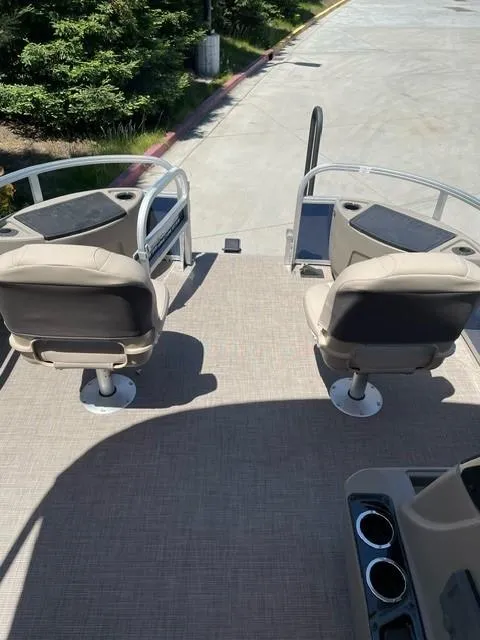 Slide: The Image of 2025 Sun Tracker Bass Buggy 18 DLX boat interior with two swivel seats. - 8
