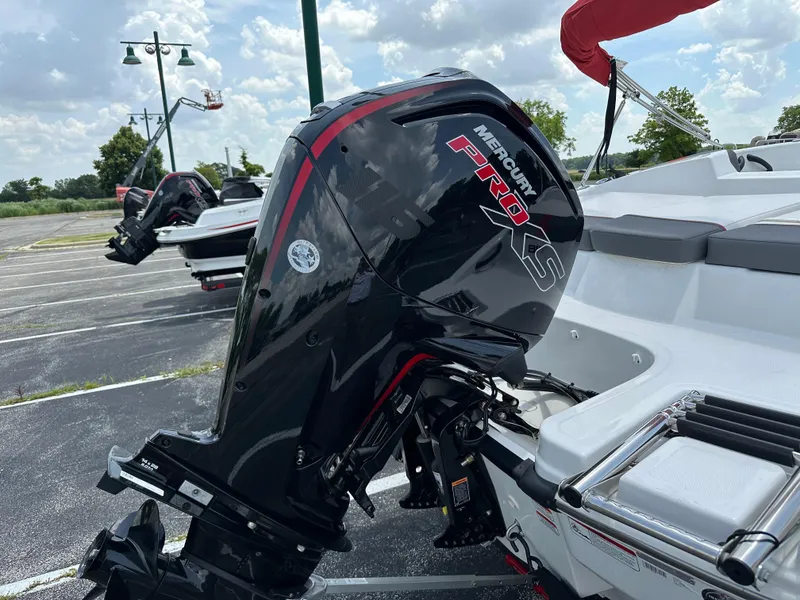 Slide: The Image of 2025 Tahoe T18 boat with Mercury Pro XS outboard motor in a parking lot. - 4