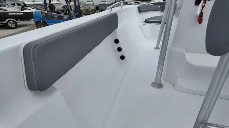 Slide: The Image of 2025 ALK2 Powerboats 22CRX interior with gray seating and sleek design. - 13