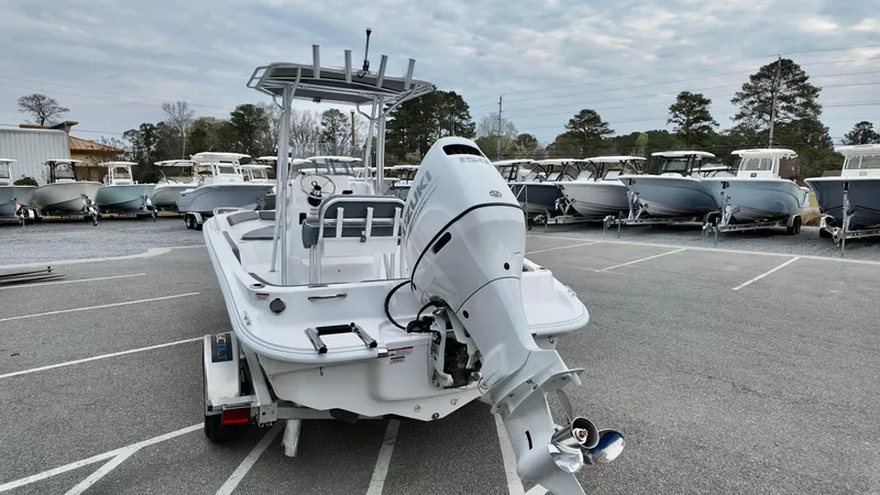 Slide: The Image of 2025 ALK2 Powerboats 22CRX in a parking lot, surrounded by other boats. - 3