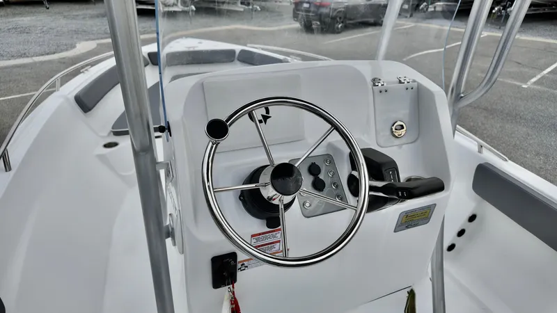 Slide: The Image of 2025 ALK2 Powerboats 22CRX steering console with modern controls and sleek design. - 8