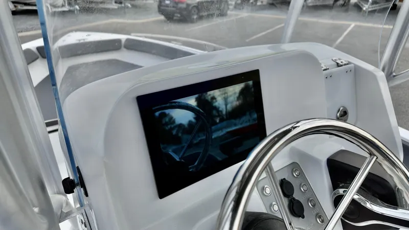 Slide: The Image of 2025 ALK2 Powerboats 22CRX dashboard with steering wheel and digital display. - 9