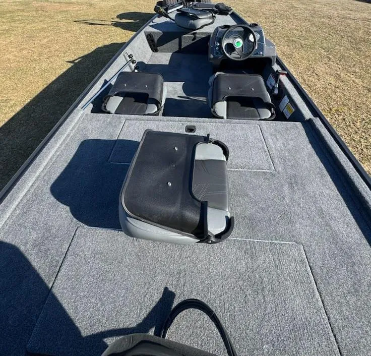 Slide: The Image of 2025 Tracker Bass Tracker Classic XL boat interior with seating and steering console. - 6