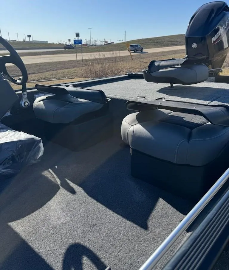 Slide: The Image of 2025 Tracker Bass Tracker Classic XL boat interior with seating and motor. - 7