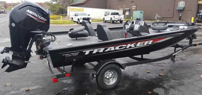 Slide: The Image of 2025 Tracker Pro Team 175 Crappie Edition boat with Mercury engine on trailer. - 3