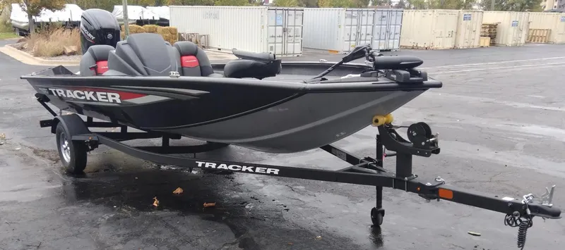 Slide: The Image of 2025 Tracker Pro Team 175 Crappie Edition boat on trailer in parking lot. - 6