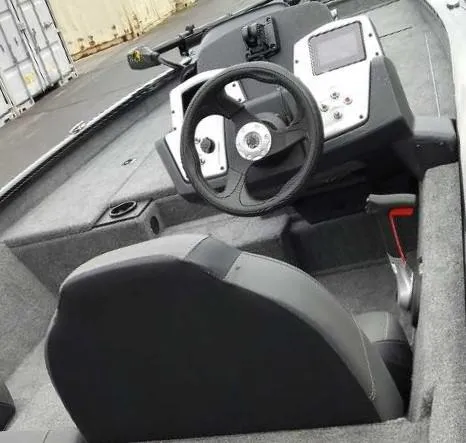 Slide: The Image of 2025 Tracker Pro Team 175 Crappie Edition boat interior with steering wheel and dashboard. - 9