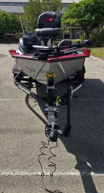 Slide: The Image of 2025 Tracker Pro Team 175 boat on trailer in outdoor setting. - 4