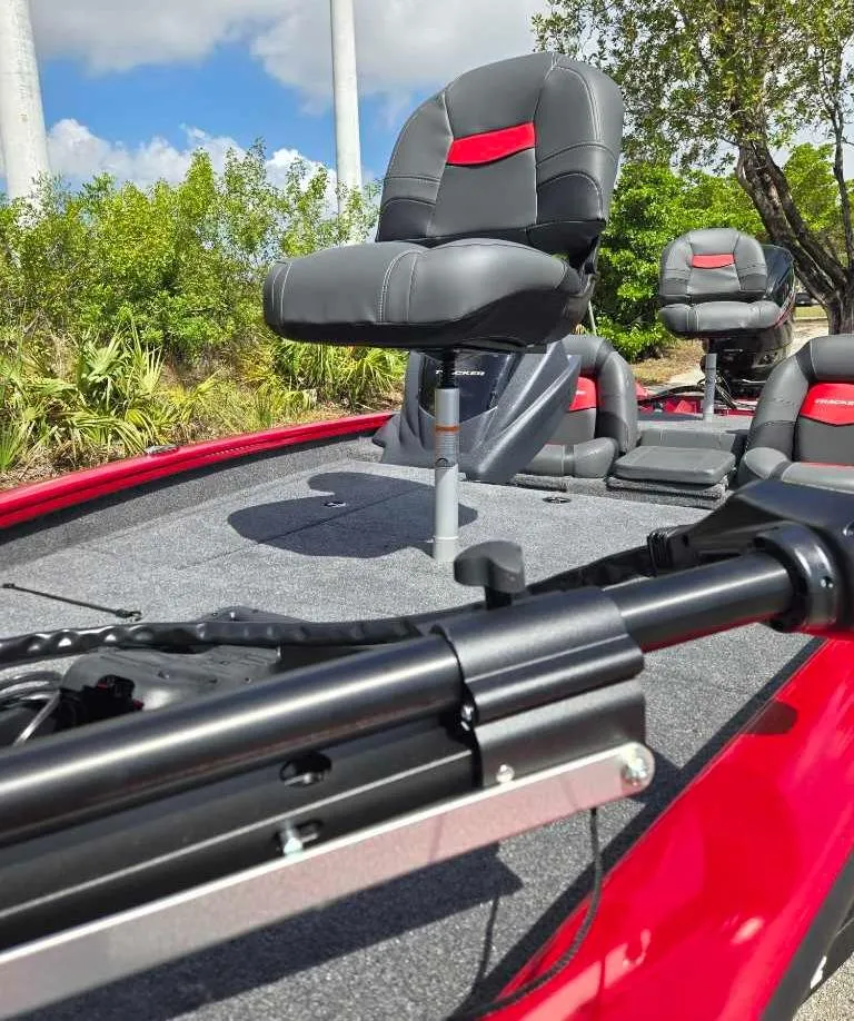 Slide: The Image of 2025 Tracker Pro Team 175 boat with red and black seating, outdoor setting. - 7
