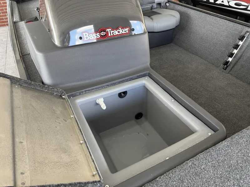 Slide: The Image of 2025 Tracker Bass Tracker Classic XL boat interior with open storage compartment. - 12