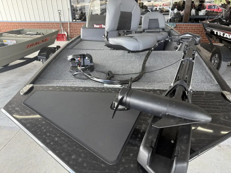 Slide: The Image of 2025 Tracker Bass Tracker Classic XL boat with seating and fishing equipment. - 2